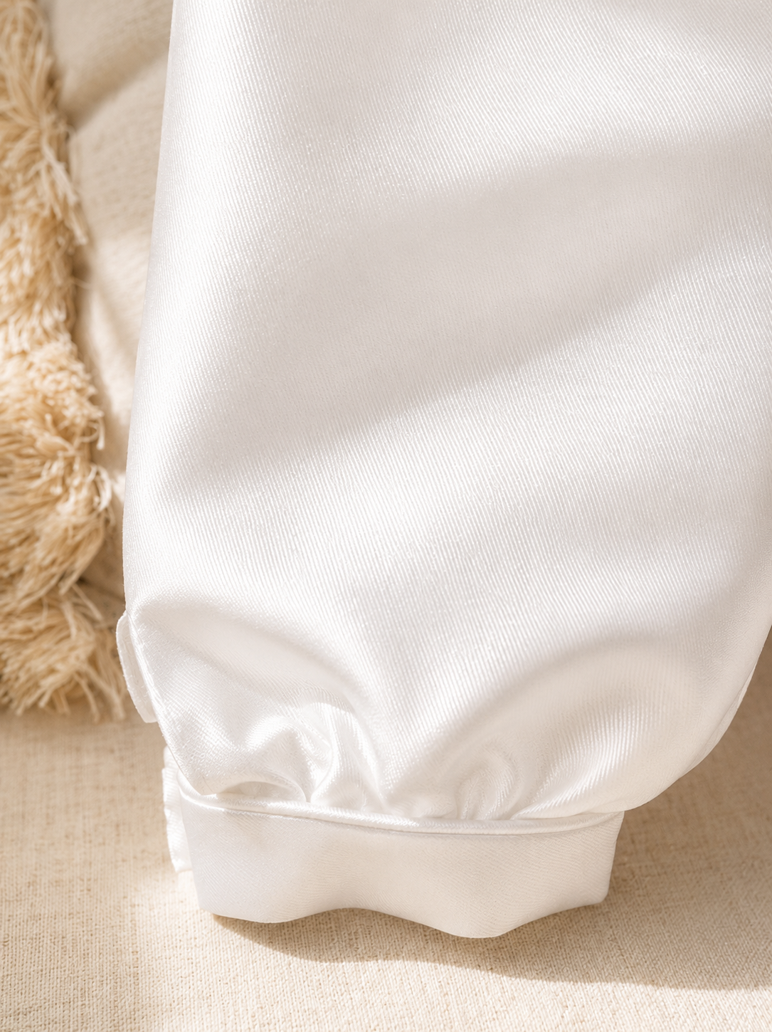 A timeless two piece set designed for baptisms, christenings and special occasions. Crafted in luxurious mikado, this classic ensemble pairs a beautifully tailored long sleeve shirt with coordinating tailored trousers and suspenders. 
