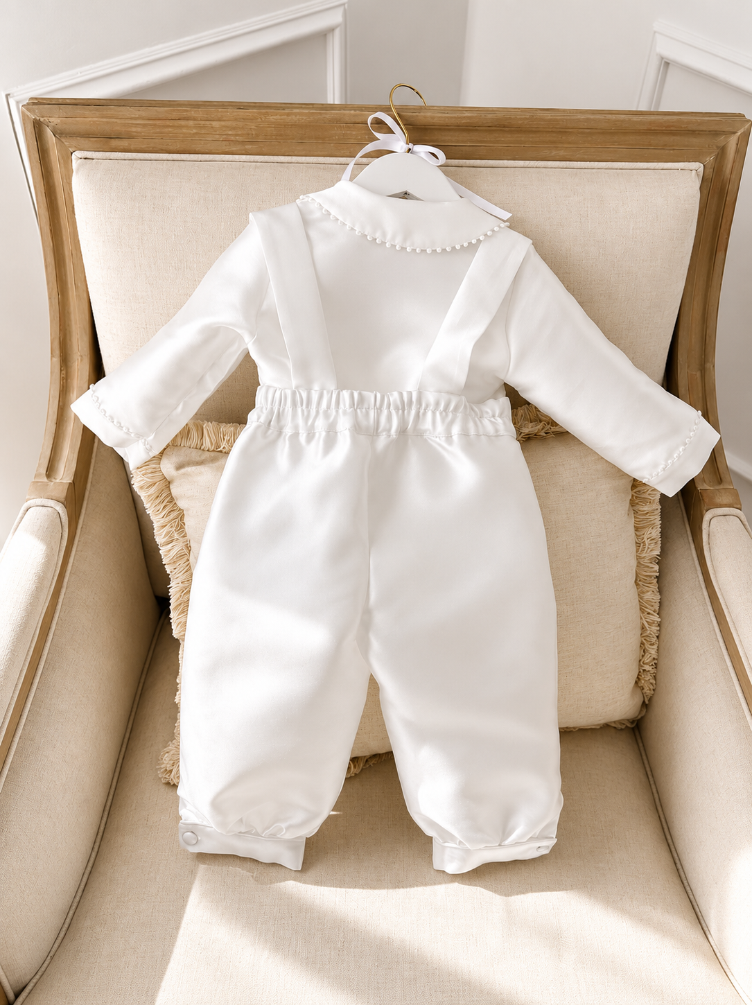 A timeless two piece set designed for baptisms, christenings and special occasions. Crafted in luxurious mikado, this classic ensemble pairs a beautifully tailored long sleeve shirt with coordinating tailored trousers and suspenders. 