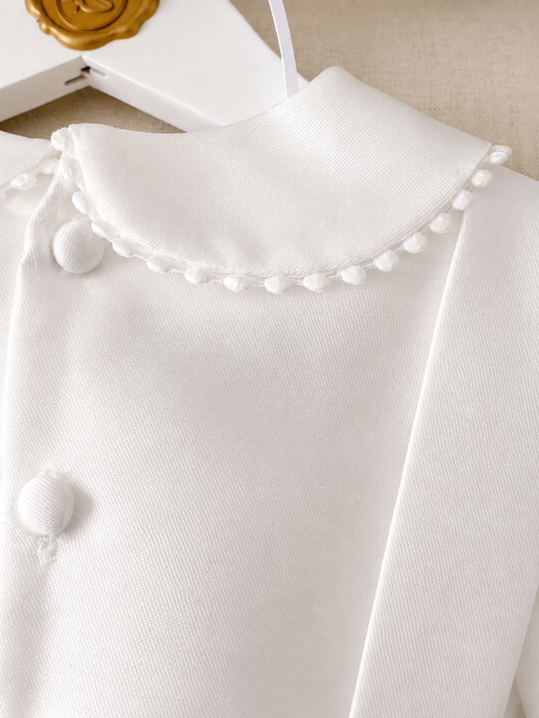 A timeless two piece set designed for baptisms, christenings and special occasions. Crafted in luxurious mikado, this classic ensemble pairs a beautifully tailored long sleeve shirt with coordinating tailored trousers and suspenders. 