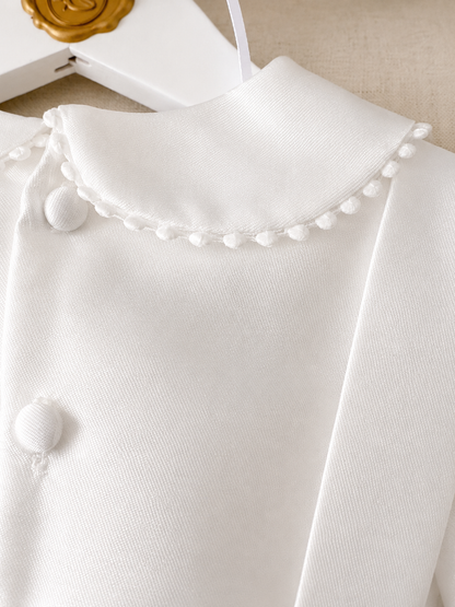 A timeless two piece set designed for baptisms, christenings and special occasions. Crafted in luxurious mikado, this classic ensemble pairs a beautifully tailored long sleeve shirt with coordinating tailored trousers and suspenders. 