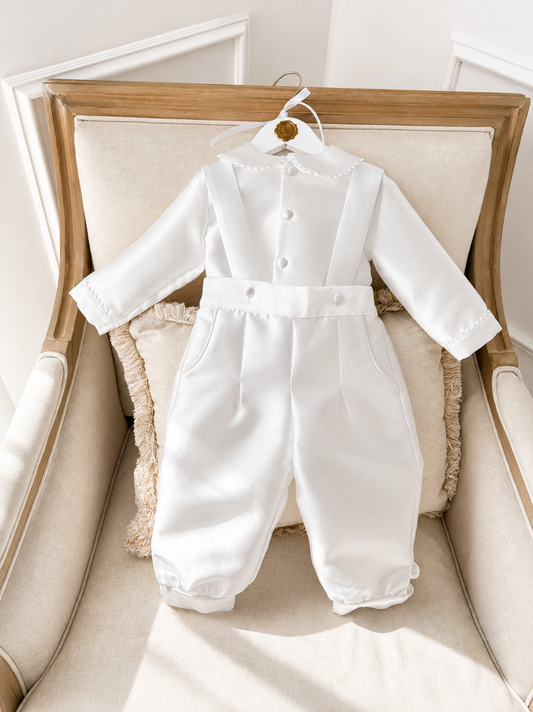 A timeless two piece set designed for baptisms, christenings and special occasions. Crafted in luxurious mikado, this classic ensemble pairs a beautifully tailored long sleeve shirt with coordinating tailored trousers and suspenders. 
