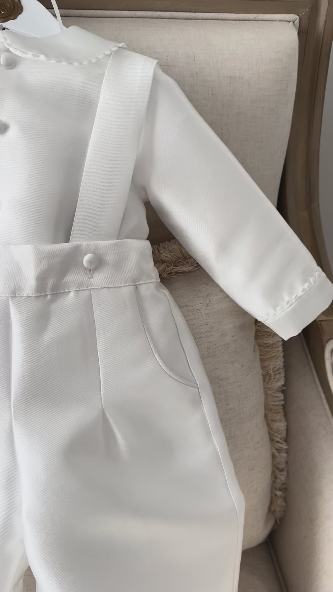A timeless two piece set designed for baptisms, christenings and special occasions. Crafted in luxurious mikado, this classic ensemble pairs a beautifully tailored long sleeve shirt with coordinating tailored trousers and suspenders. 