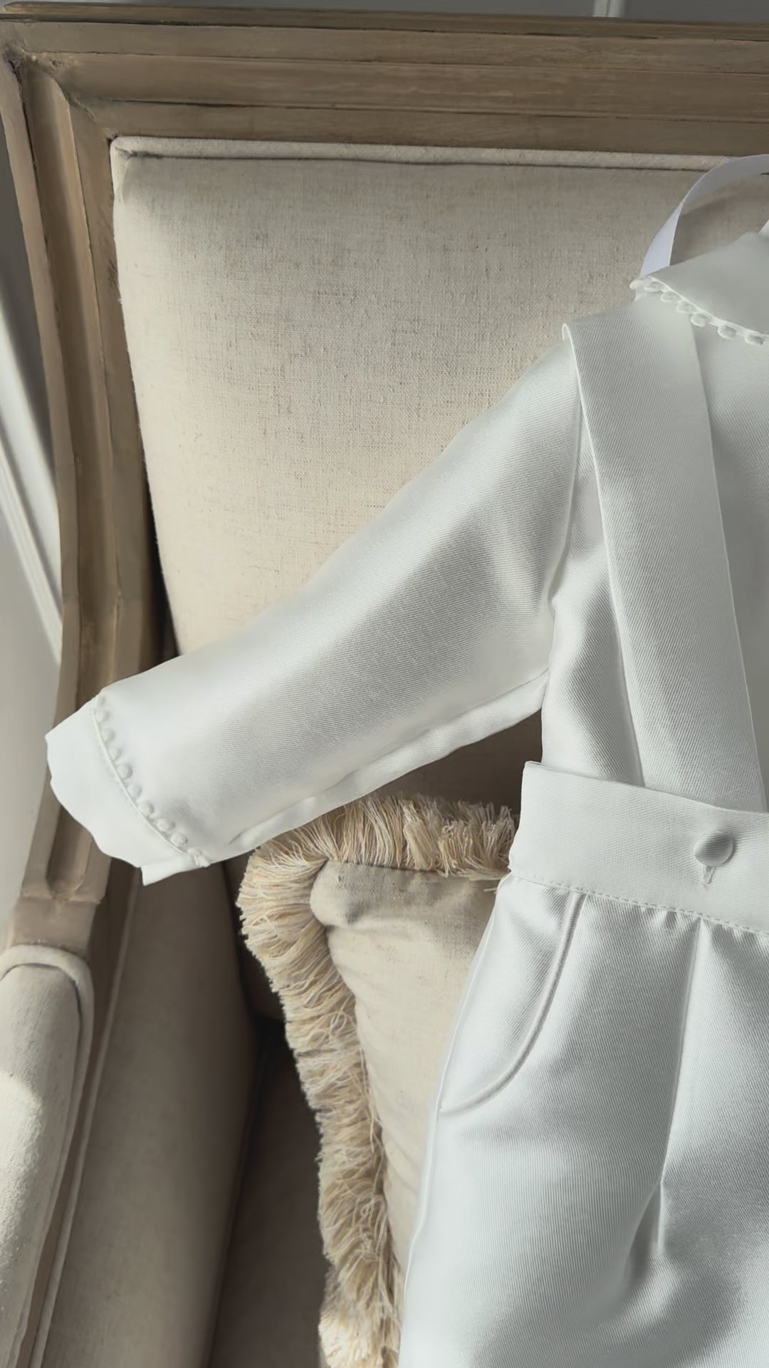 A timeless two piece set designed for baptisms, christenings and special occasions. Crafted in luxurious mikado, this classic ensemble pairs a beautifully tailored long sleeve shirt with coordinating tailored trousers and suspenders. 